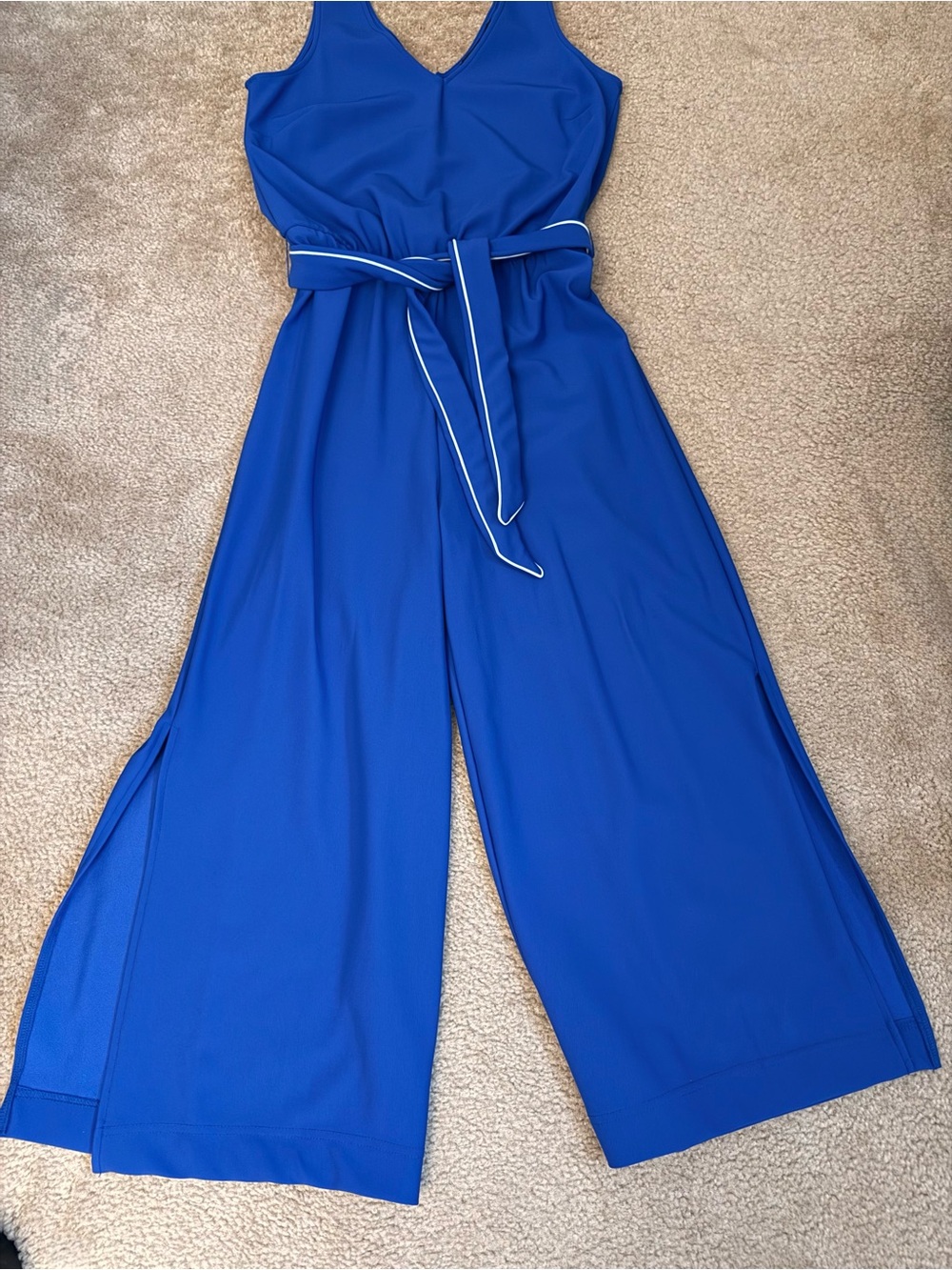 BOSTON PROPER BEYOND TRAVEL sapphire colored jumpsuit, contrast stitch belt.